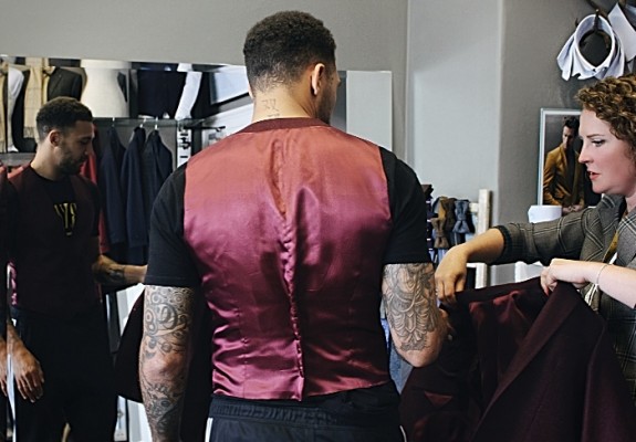 Jay being fitted in red suit