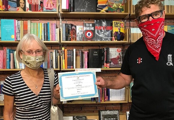 certificate - Maggie Thomason - Hough and District WI presents Local Hero cert to Steve Lawson - Nantwich Bookshop (1)