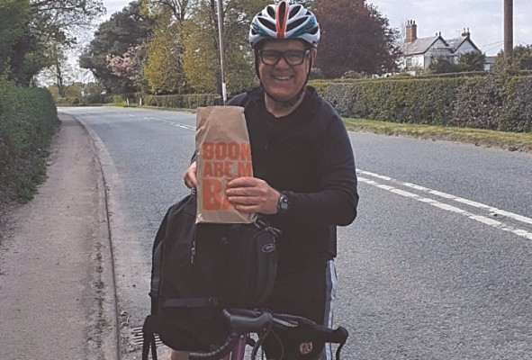 Steve Lawson on his bicycle with a book delivery (1)