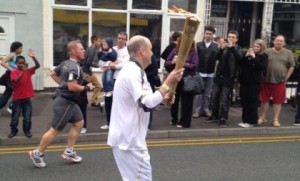 Thousands line rainy streets to see Olympic Torch in Crewe