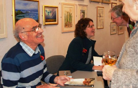 Andrew Lamberton and Anne Wheeler signing copies of their book