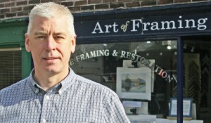 Nantwich shop owner in the picture for framing award