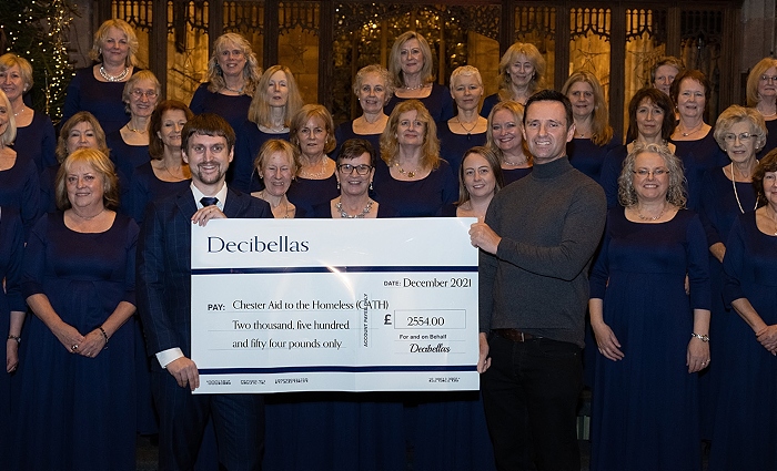 Decibellas choir cheque for homeless charity