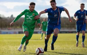 First-half - Akiel Raffie on the ball under pressure (1)