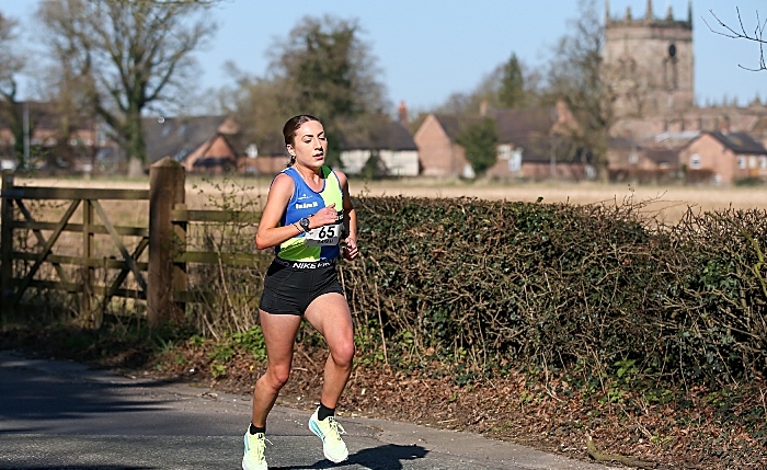 Nantwich 10K road race - 1st female - Sarah Dufour-Jackson - with St Mary's Acton in the background (1)