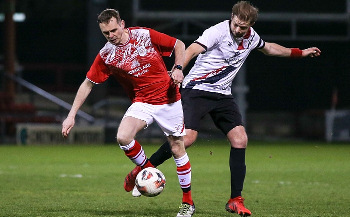 Opposition players Daniel Sanderson and Gareth Griffith fight for the ball (1)