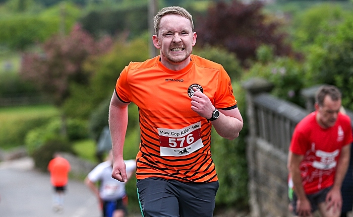 A runner pushes himself to the limit on the steepest section at Top Station Road (1)