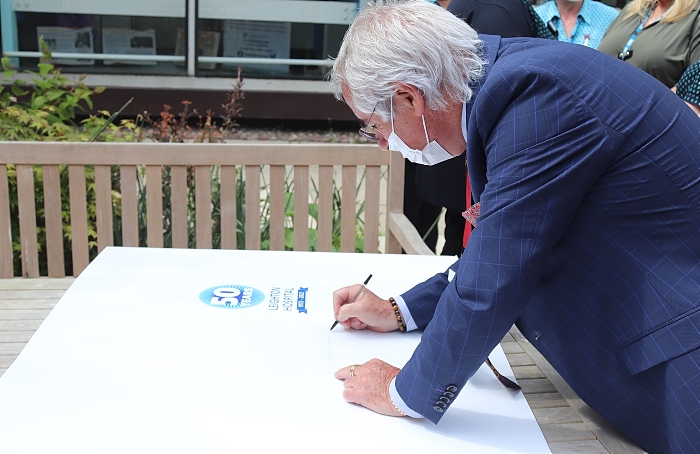 Chairman signing the card - Leighton Hospital