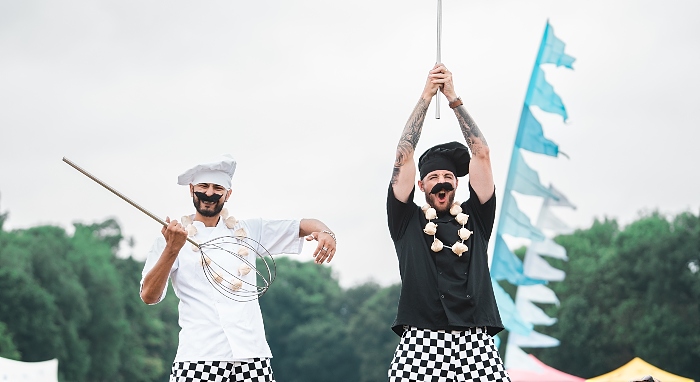 chefs on stilts at food festival