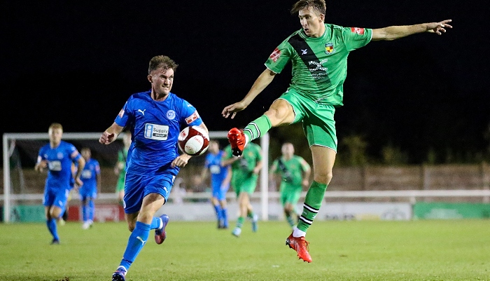 Second-half - Dan Cockerline rises to win the ball from Josh Langley (1)