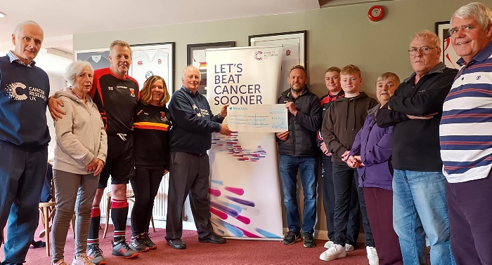 Neil Fearn (left) from Cancer Research UK receives the cheque at Crewe Vagrants Sports Club (1)
