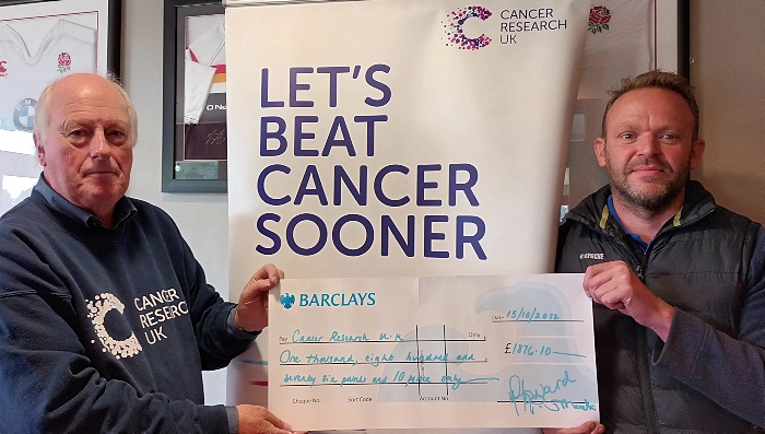 Neil Fearn (left) from Cancer Research UK receives the cheque from Rob Knight (Sarah's husband) at Crewe Vagrants Sports Club (1)