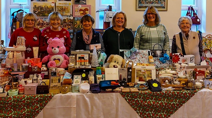 Volunteers on stalls in the church hall - Holly Fair