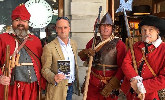 Charles Cordell (holding his novel) with English Civil War re-enactors at a previous event (1) (1)