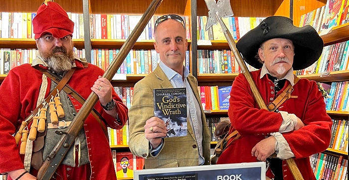 Author Charles Cordell (holding his novel) with English Civil War re-enactors at a previous event (2) (1)