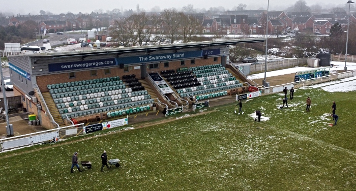 Fans and volunteers clear nantwich Town pitch
