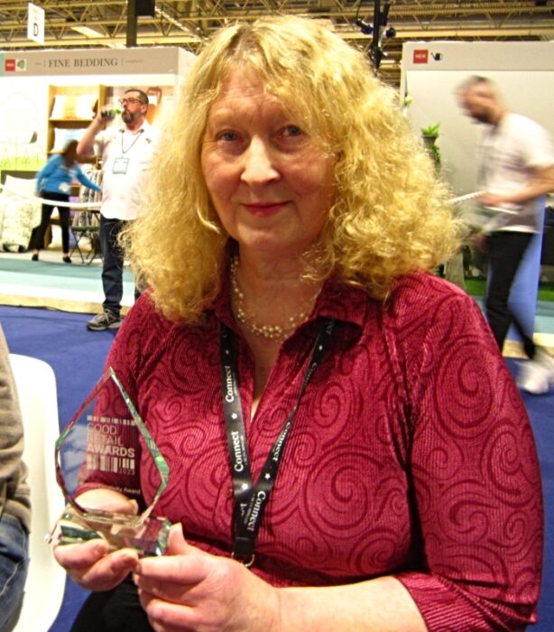 Judy Evans with award