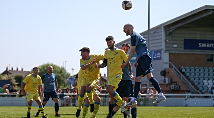 Players rise for the ball (1)