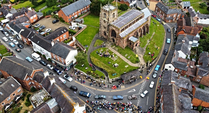 Aerial view of vehicle parade passing St James' Church in Audlem (2) (1)