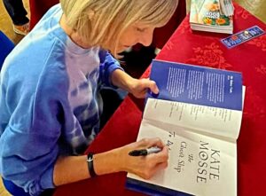 Kate Mosse signs a copy of The Ghost Ship - author