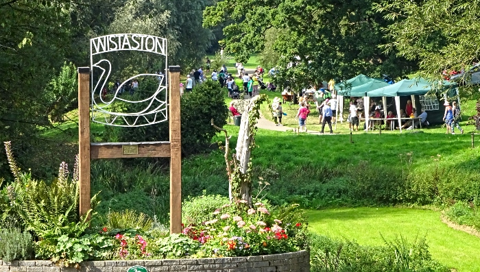 Wistaston sign and visitors enjoying the stalls (1)