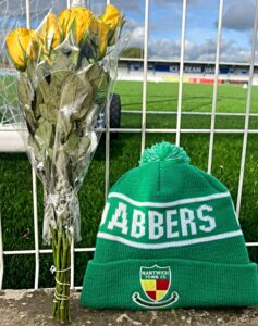 Pre-match - flowers and Dabbers hat pitchside in memory of Bob Antrobus (1)