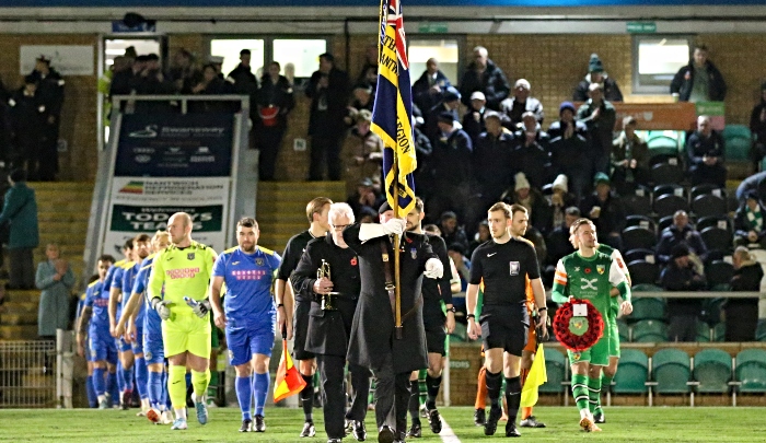 Nantwich & District Branch of the Royal British Legion Standard Bearer Geoff Davis-Palin leads the match officials and players onto the pitch (1)