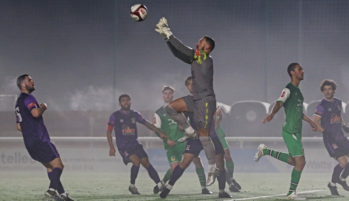 Second-half - Witton keeper Ollie Martin rises to catch the ball in the mist (1)
