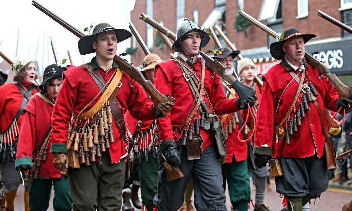 Publicity photo - - musketeers in parade down High Street