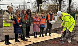 Pupils bury time capsule on new housing estate in Aston