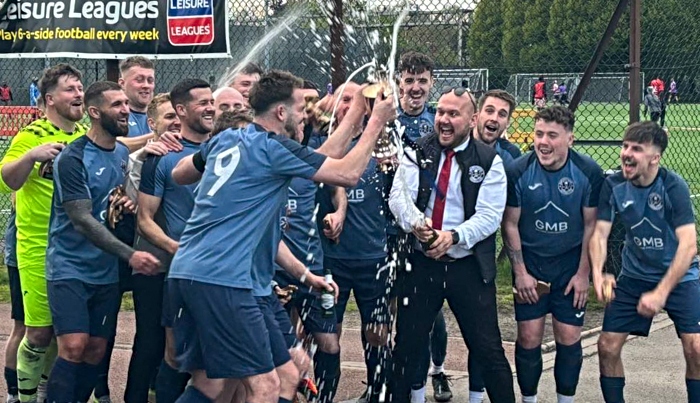 Nantwich Pirates FC celebrate victory with a bottle of bubbly (1)