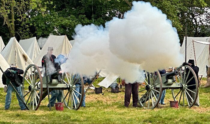 American Civil War Society soliders fire a cannon at the opposition