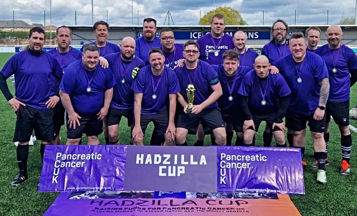 cancer match - The winning purple team with the Hadzilla Cup