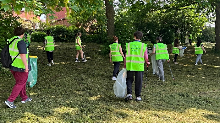 students cleaning along River Weaver