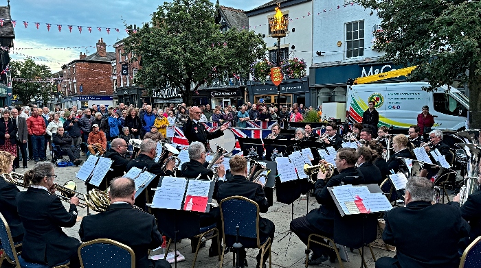 Spectators watch the Cheshire Police Band after the D-Day 80 beacon is lit (1)