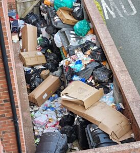 piles of rubbish outside nantwich apartment block