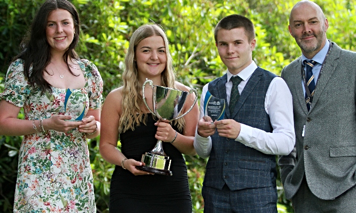 Business award winners Ffion Roberts, Lauren Salmon, Ben Williams and Course Manager Jonathan Gateley