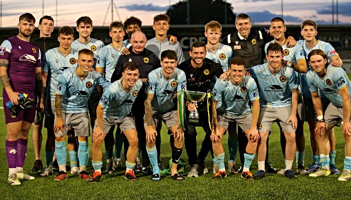 Prescot Cables team and management celebrate victory with the 1884 Cup