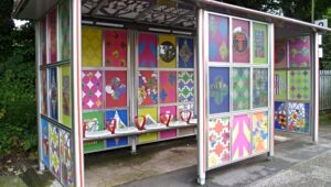 train station shelters with pupils' artwork