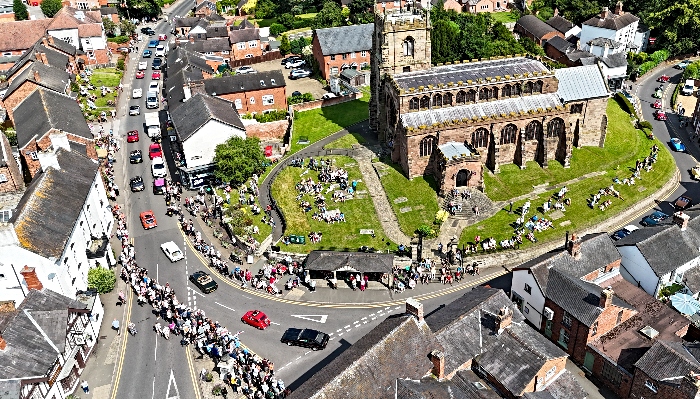 Aerial view of vehicle parade passing St James' Church in Audlem (2) (1)