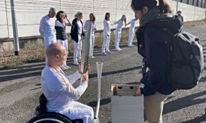 Andy Small hands over Paralympic torch to Paris team