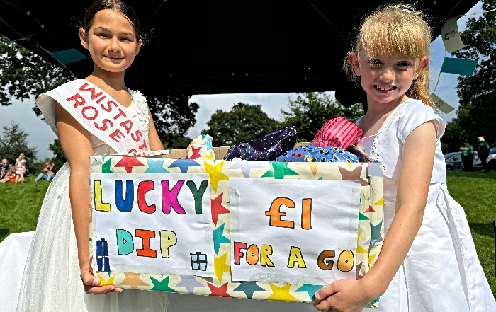 l-r Wistaston Rose Queen, Lucia Kemp and her Attendant, Cerys McKeown on their stall