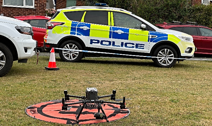 police car and drone in search for missing teen