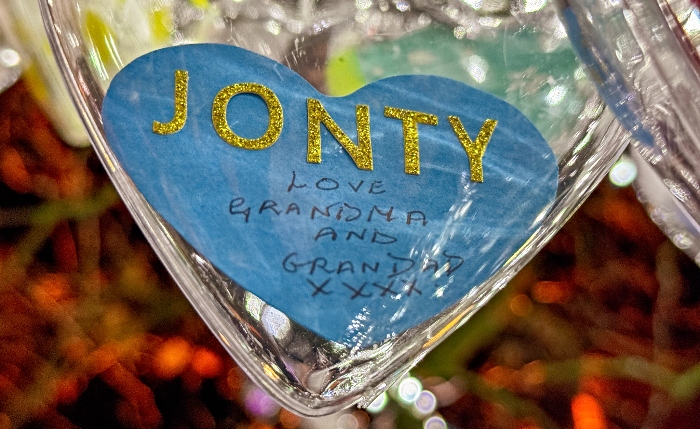 A bauble for Jonty Evans which reads Love Grandma and Grandad xxxx (1)