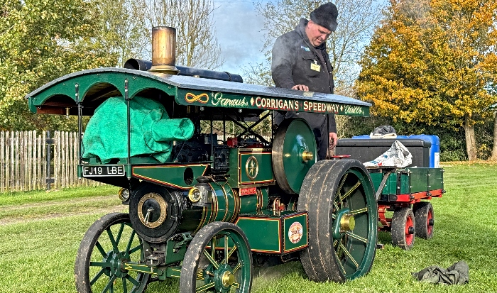 An owner inspects their miniature steam traction engine (1)