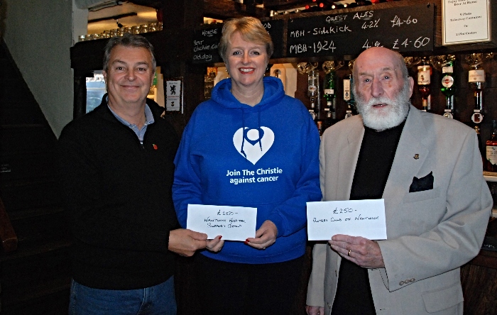 Black Lion presents charity cheques from event