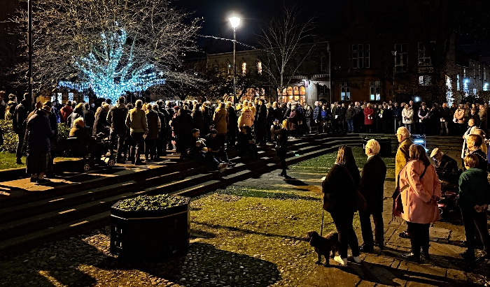 The Tree of Light (left) is illuminated during the song, ‘Let us light a candle’