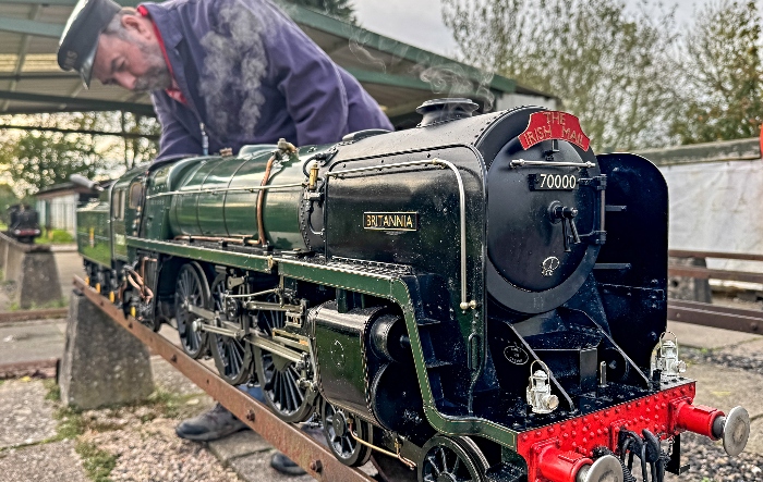 A Society volunteer inspects a miniature-gauge steam loco (1)