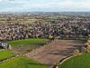 aerial view of land in foreground being eyed by Redrow Homes