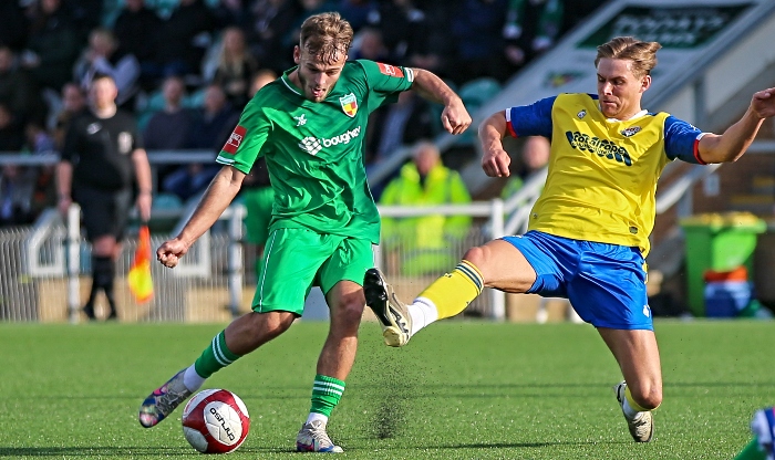 First-half - Kai Evans shoots at goal under pressure (1)